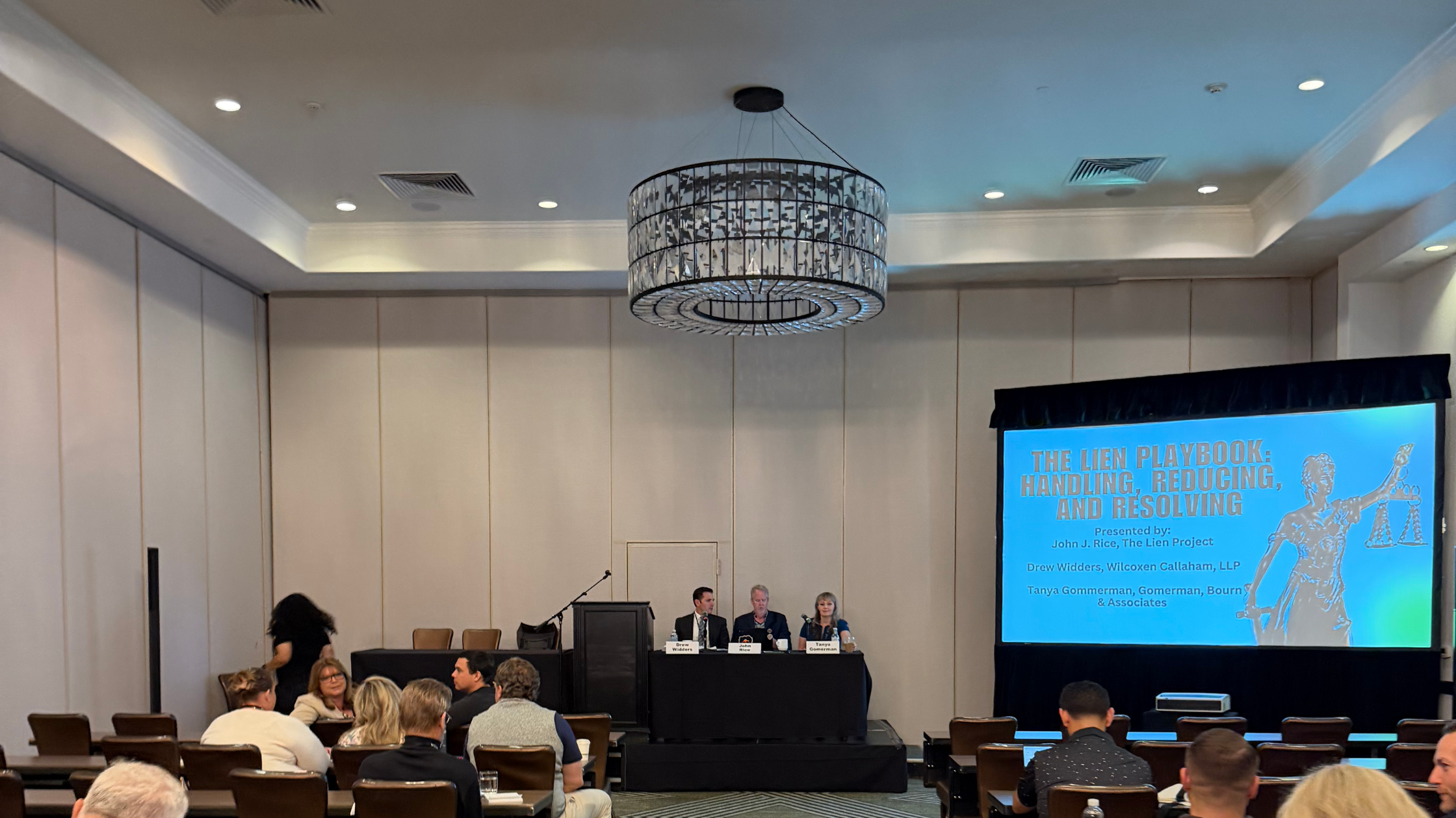 Tanya Gomerman and fellow attorneys speaking on lien resolution during panel discussion